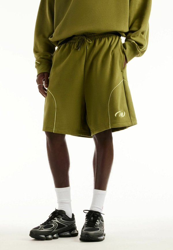 New Balance TRACKSIDE FRENCH TERRY SHORT 7" - Tracksuit bottoms - sport green