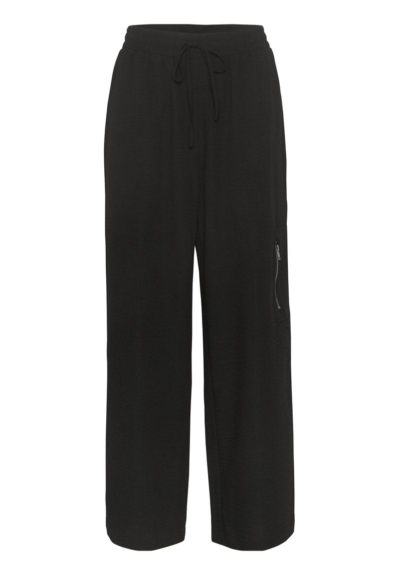 Schwarze weite Hosen mit elastischem Bund, Kordelzugverschluss und einer Reißverschlusstasche an der Seite. Hergestellt aus weichem, atmungsaktivem Material.