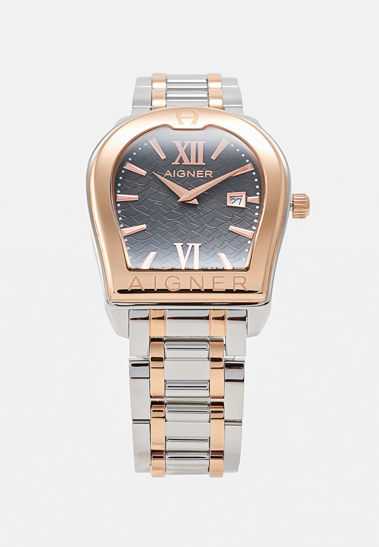 Silberne und roségoldene Aigner-Armbanduhr mit schwarzem strukturiertem Zifferblatt, römischen Ziffern XII und VI, Datumsanzeige und zweifarbigem Metallgliederarmband.