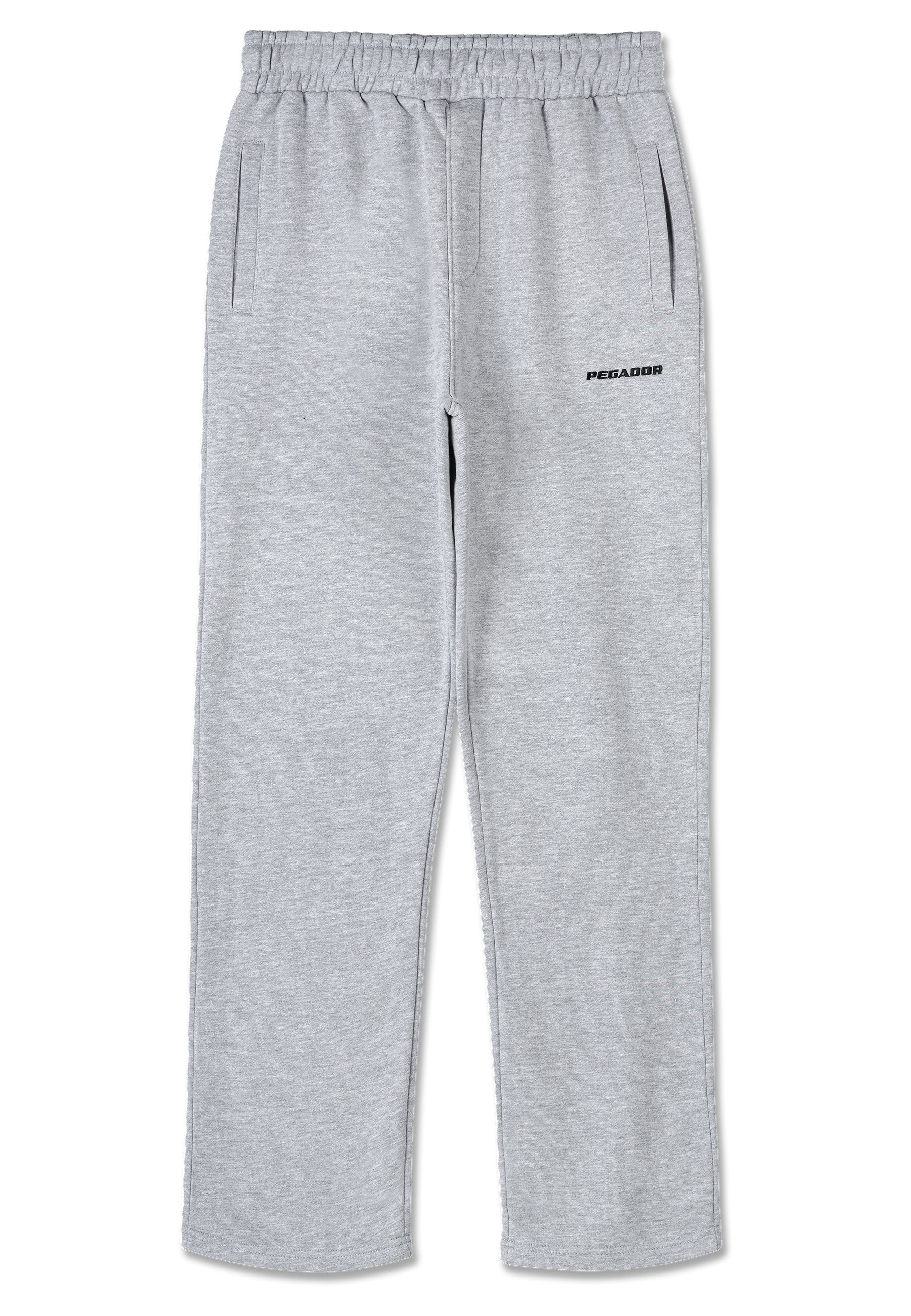 Graue Sweatpants aus einem Baumwollmischgewebe, mit einem elastischen Bund, seitlichen Taschen und einem schwarzen Logodetail am linken Oberschenkel.