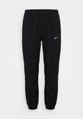 Nike Performance MILER - Tracksuit bottoms - black