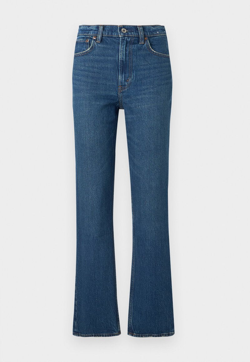 Hoch taillierte, ausgestellte Jeans aus dunkelblauem Denim. Mit klassischem Fünf-Taschen-Design, Kupfernieten und einer strukturierten Oberfläche mit dezenten Verwaschungen.