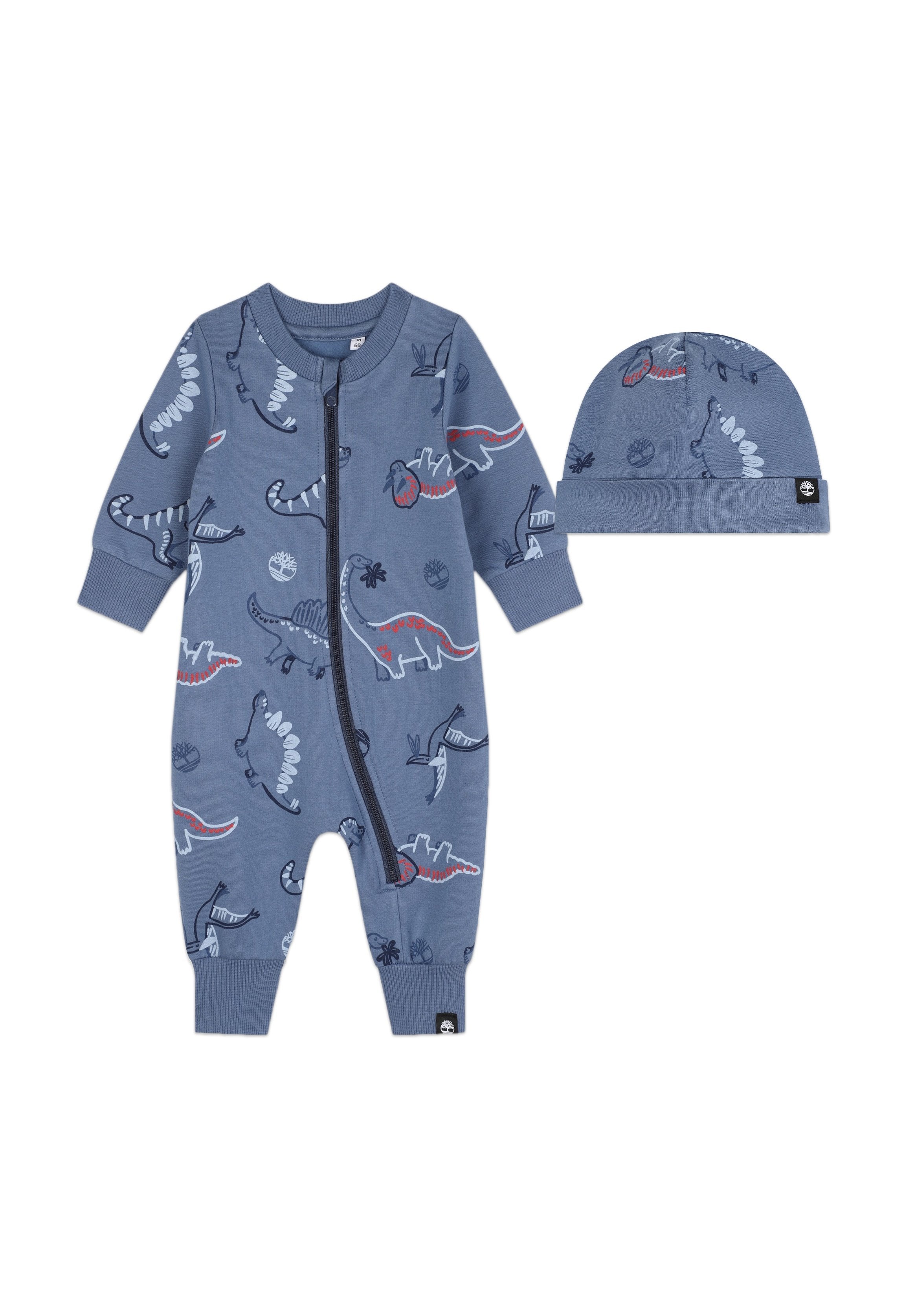 Hellblauer Baby-Overall aus Baumwolle mit Dinosaurier-Muster, ausgestattet mit einem Frontreißverschluss und passendem Mütze. Gerippte Bündchen und Saumakzente.