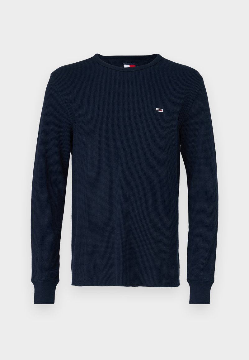 Marineblaues Langarmshirt aus strukturiertem Strickstoff mit Rundhalsausschnitt und gerippten Bündchen, mit einem kleinen Logo auf der Brust.
