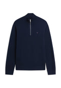 Marineblauer Langarmpullover mit geripptem hohen Kragen, halbem Reißverschluss und kleinem rot-weiß-blauem Logo auf der Brust.
