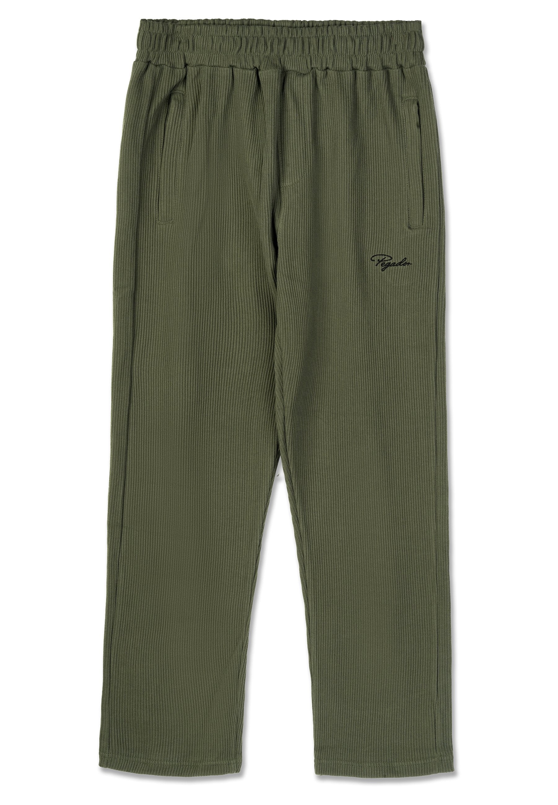 Olivgrüne gerippte Hose mit elastischem Bund, Seitentaschen und einem kleinen schwarzen Logo auf der Vorderseite. Der Stoff hat eine strukturierte Oberfläche.