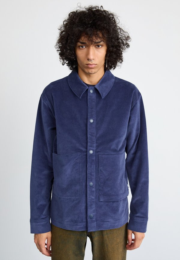 New Balance OVERSHIRT