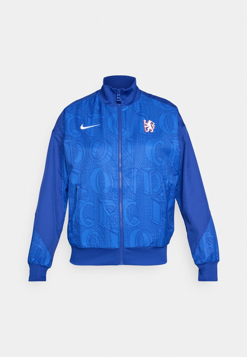 Blaues Zip-Jacke mit strukturiertem Muster, das "LONDON" und "CFC" zeigt, Nike-Logo, hoher Kragen und elastische Bündchen.