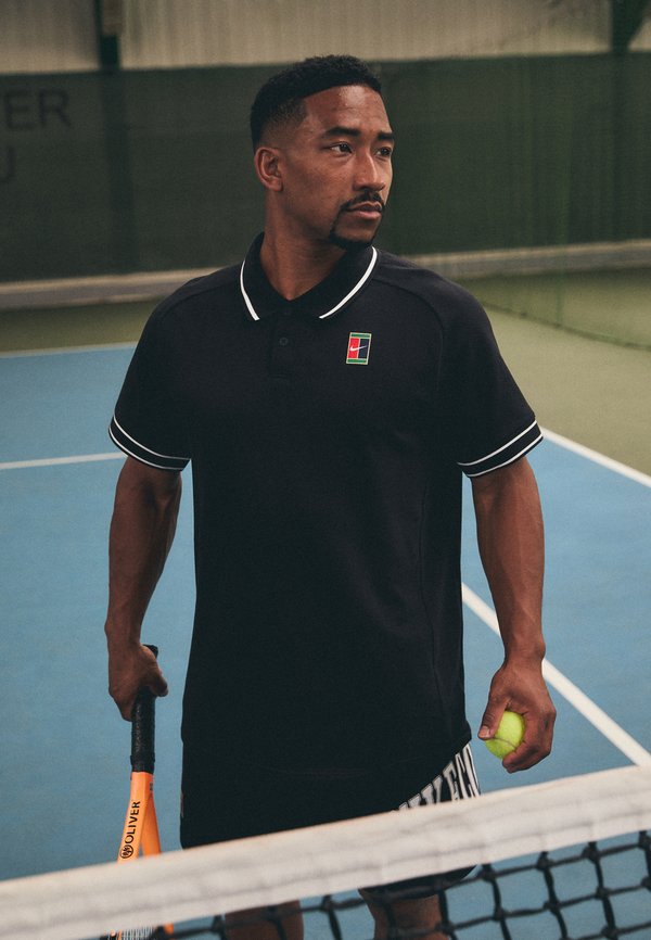 Nike Performance HERITAGE - Polo shirt - black/white