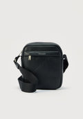 Calvin Klein EMBLEM AOP EMBOSS REPORTER - Cross body bag - black