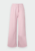 Helle rosa weite Hosen mit einem elastischen Bund und Bindebanddetails, vor einem neutralen Hintergrund präsentiert.