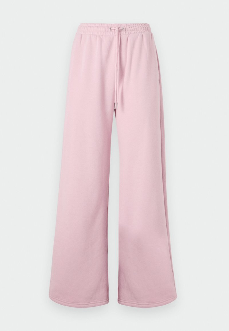 Helle rosa weite Hosen mit einem elastischen Bund und Bindebanddetails, vor einem neutralen Hintergrund präsentiert.