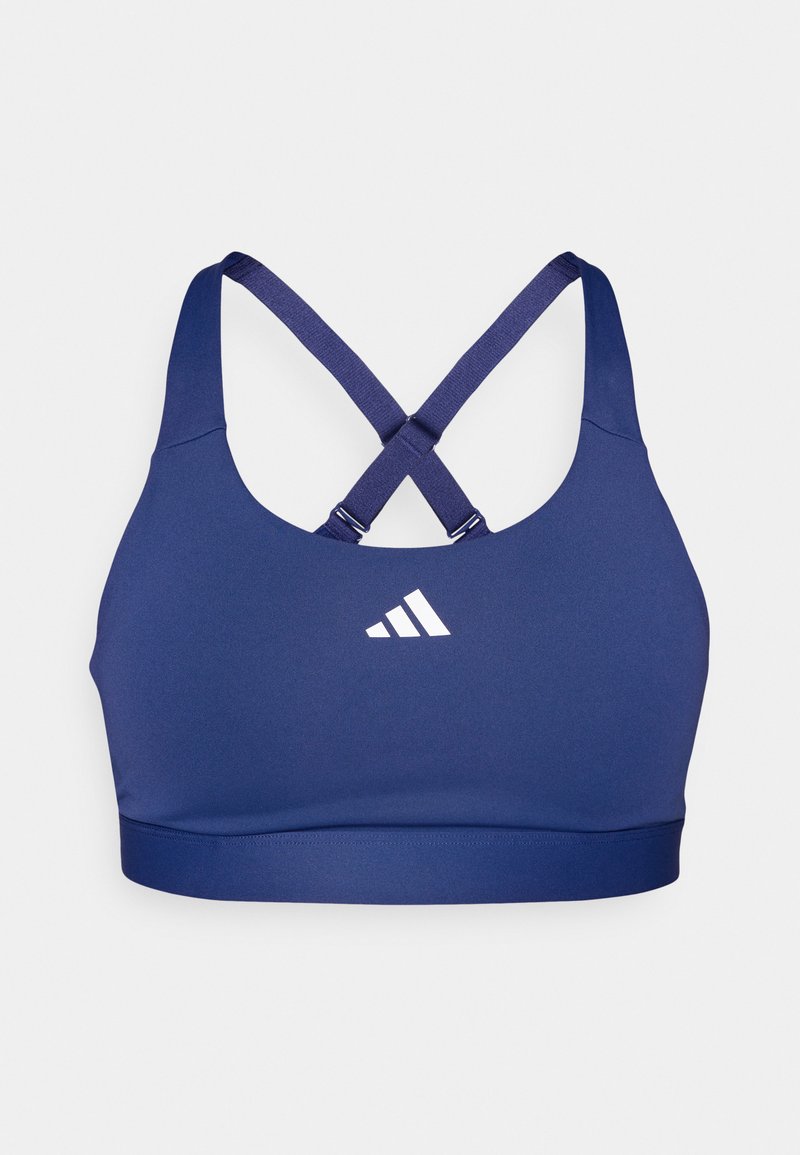 Marineblauer Sport-BH mit angepasstem Design, kreuzförmigen Trägern und Details in Weiß. Hergestellt aus dehnbarem, feuchtigkeitsableitendem Material.