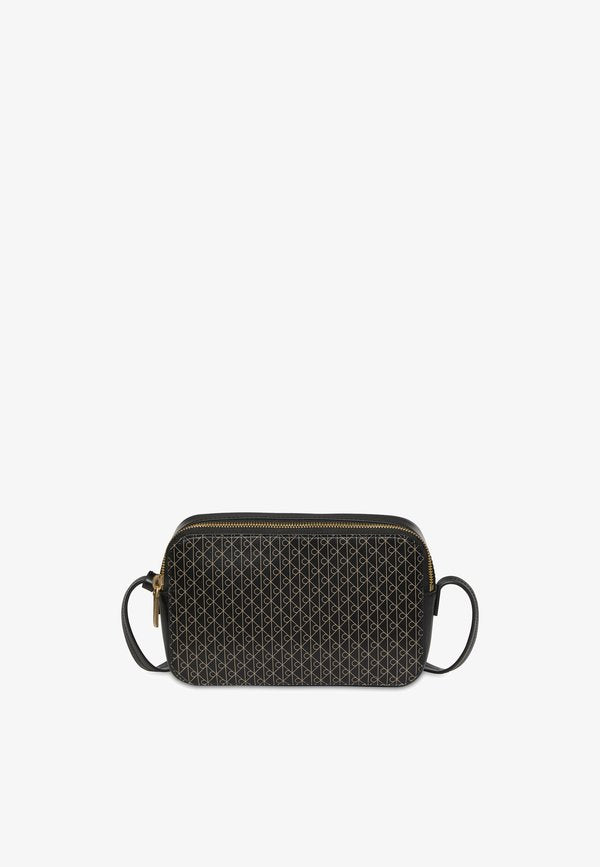Calvin Klein EMBLEM AOP ELONGATED CAMERA BAG - Cross body bag - black