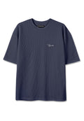 Marineblaue, gerippte Kurzarm-T-Shirt mit rundem Ausschnitt und kleinem weißen "Pegador" Logo auf der linken Brust.