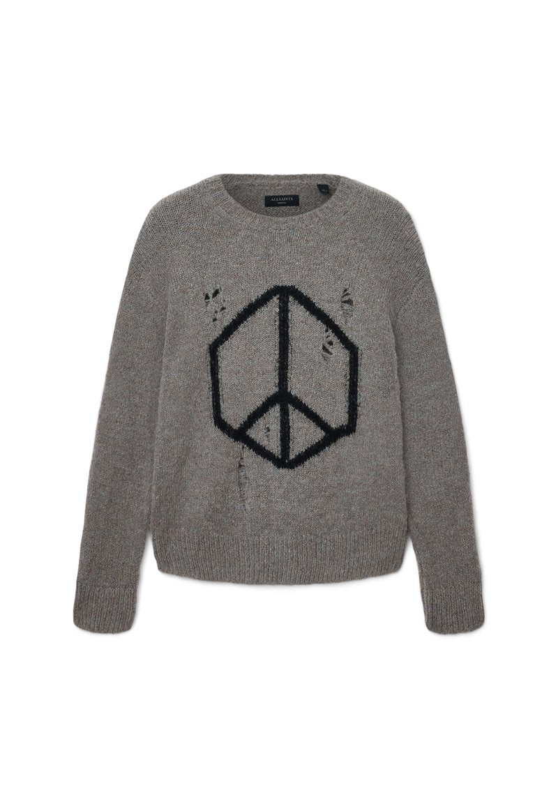 Grauer Strickpullover mit einem schwarzen geometrischen Friedenssymbol auf der Vorderseite und absichtlich eingearbeiteten Löchern im Stoff.