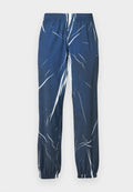 Blaue Jogginghosen mit Muster und weißem abstraktem Design, elastischem Bund und Bündchen an den Knöcheln. Hergestellt aus atmungsaktivem Stoff.