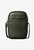 Calvin Klein EMBLEM EMBOSS SLIM REPORTER - Cross body bag - deep depths