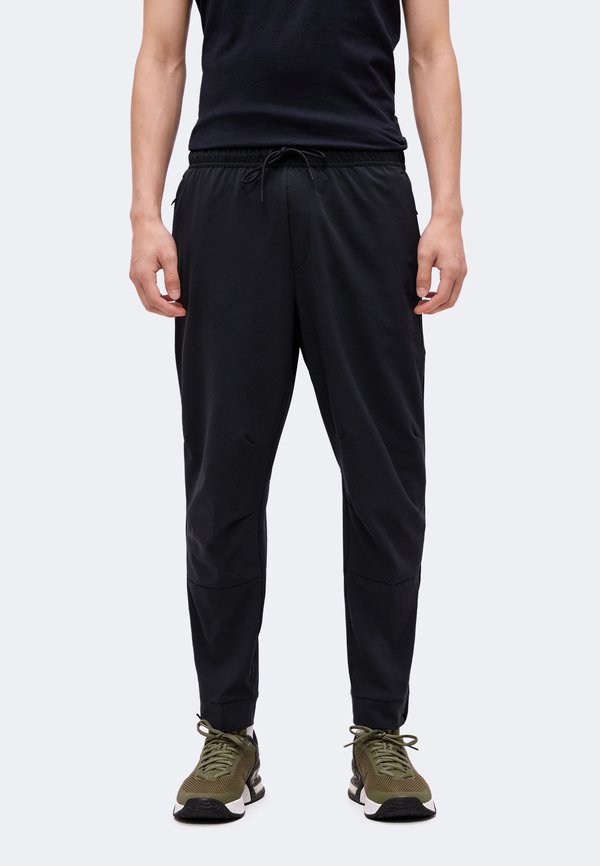 Nike Performance UNLIMITED - Tracksuit bottoms - black