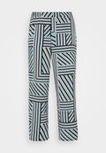Schwarz-weiße gestreifte Hosen mit einem geometrischen Muster in unterschiedlichen Breiten und Blautönen. Gummibund für zusätzlichen Komfort.