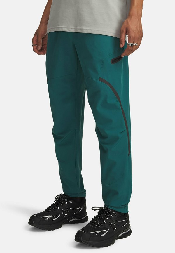 Under Armour UNSTOPPABLE - Tracksuit bottoms - rack green