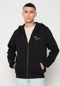Schwarze Zip-Hoodie aus weichem Stoff, mit Kordelzugkapuze, Fronttaschen und weißem "Les Deux"-Logo auf der Brust.