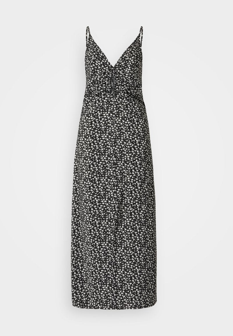 Schwarzes Maxikleid mit weißem Blumenmuster, V-Ausschnitt, schmalen Trägern und gerafftem Oberteil. Leichter Stoff mit glatter Textur.
