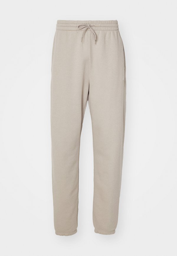 New Balance SPORT ESSENTIALS JOGGER - Tracksuit bottoms - beige