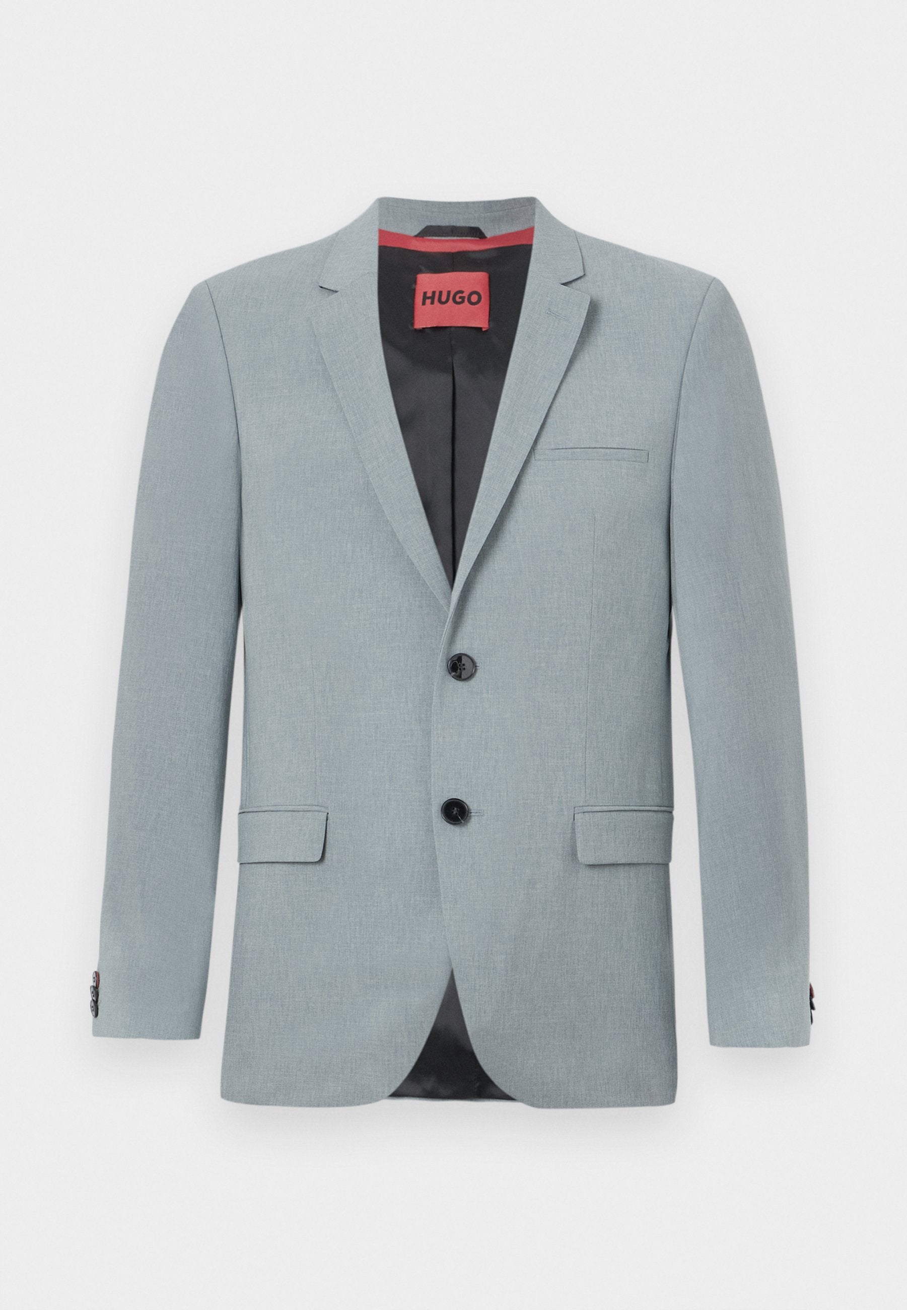 Hellgrauer Blazer aus strukturiertem Stoff, mit schwarzem Futter, zwei vorderen Taschen, Reverskragen und schwarzen Knöpfen. Rotes Etikett innen.