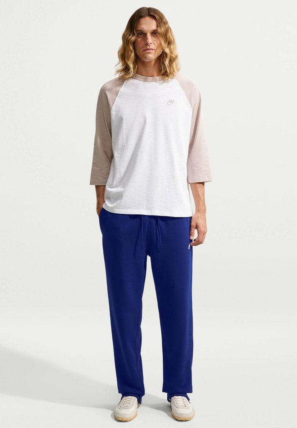 Nike Sportswear CLUB PANT - Tracksuit bottoms - deep royal blue deep royal blue white