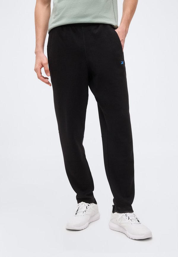 Reebok ATHLETE PANTS - Tracksuit bottoms - black/virtual blue
