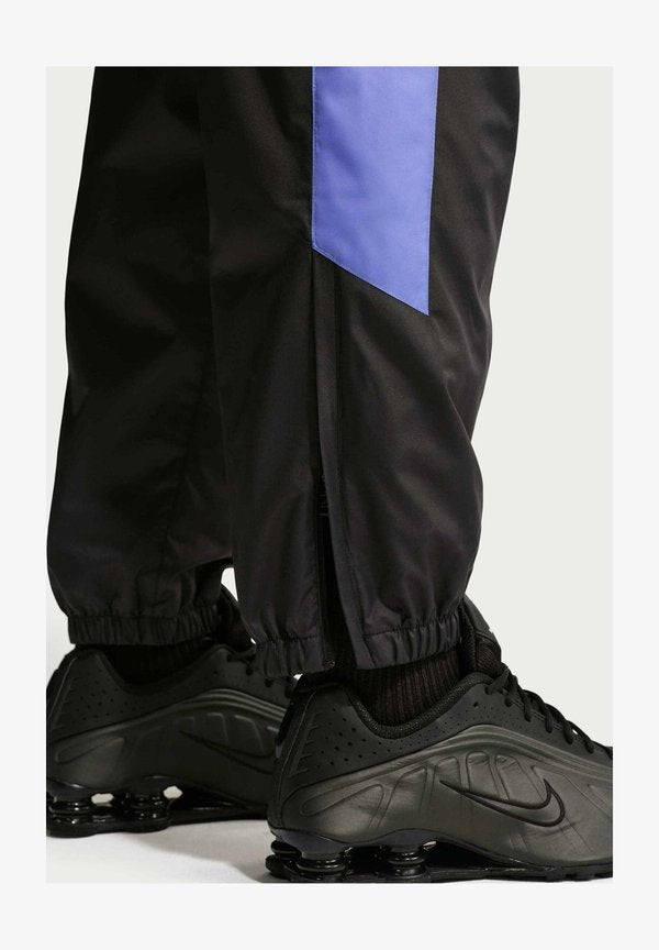 Nike Sportswear M NK WR LND PANT 26 - Tracksuit bottoms - black sapphire sapphire