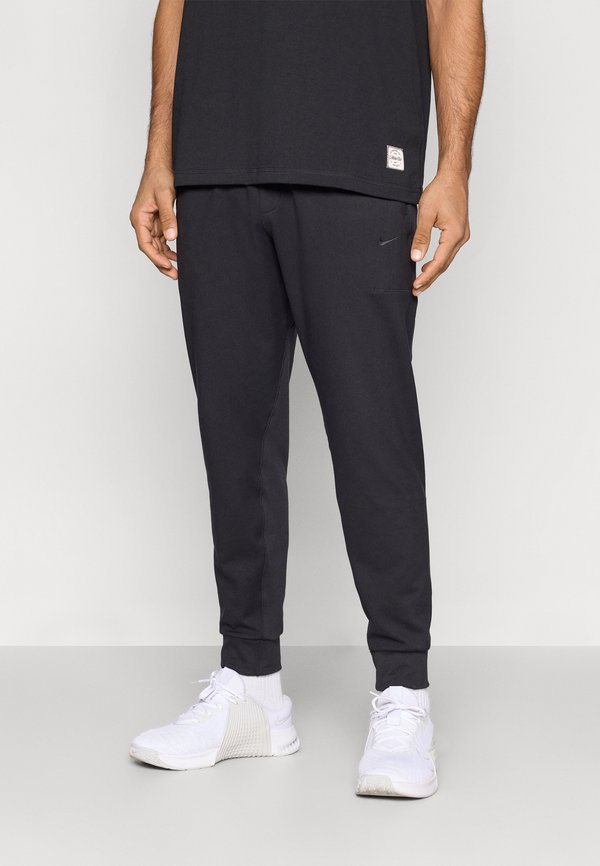 Nike Performance NANO - Tracksuit bottoms - black