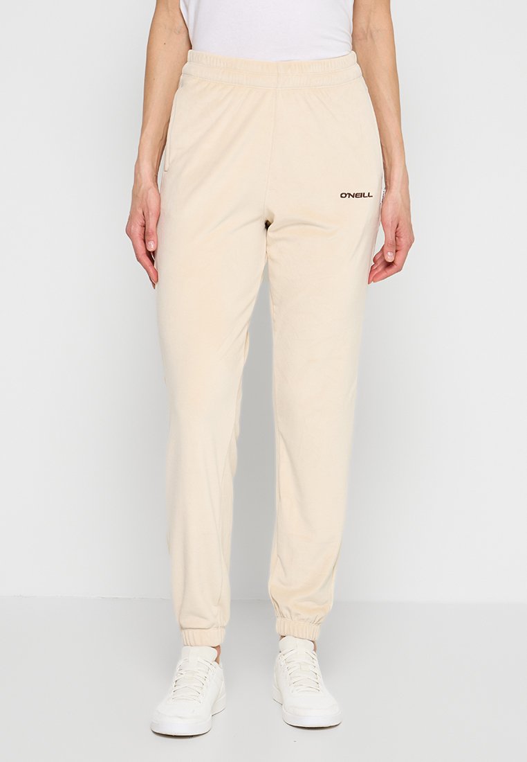 Beige Jogginghosen aus Baumwolle mit elastischem Bund und Bündchen. Verfügt über seitliche Taschen und ein in Dunkelbraun auf den linken Oberschenkel gedrucktes Logo.
