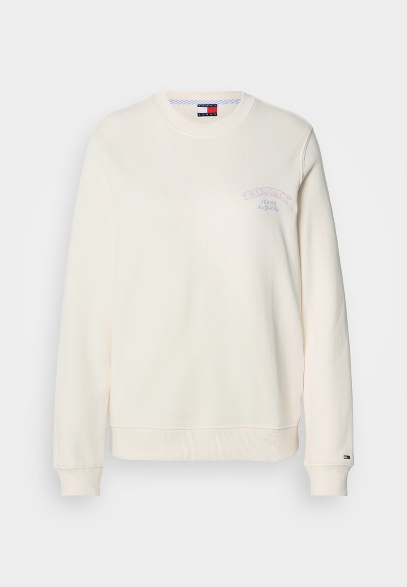 Cremfarbener Sweatshirt mit Rundhalsausschnitt, langen Ärmeln und einem kleinen lila Logo auf der Brust. Weicher, strukturiertes Material mit gerippten Bündchen.