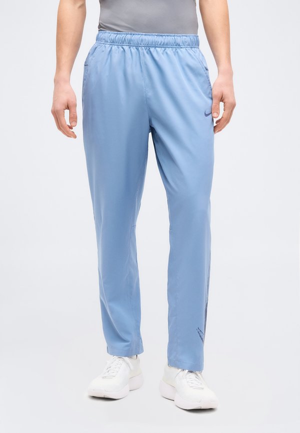 Nike Performance FORM  - Tracksuit bottoms - work blue