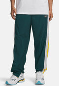 Under Armour ICON WOVEN TRACK - Tracksuit bottoms - arden green