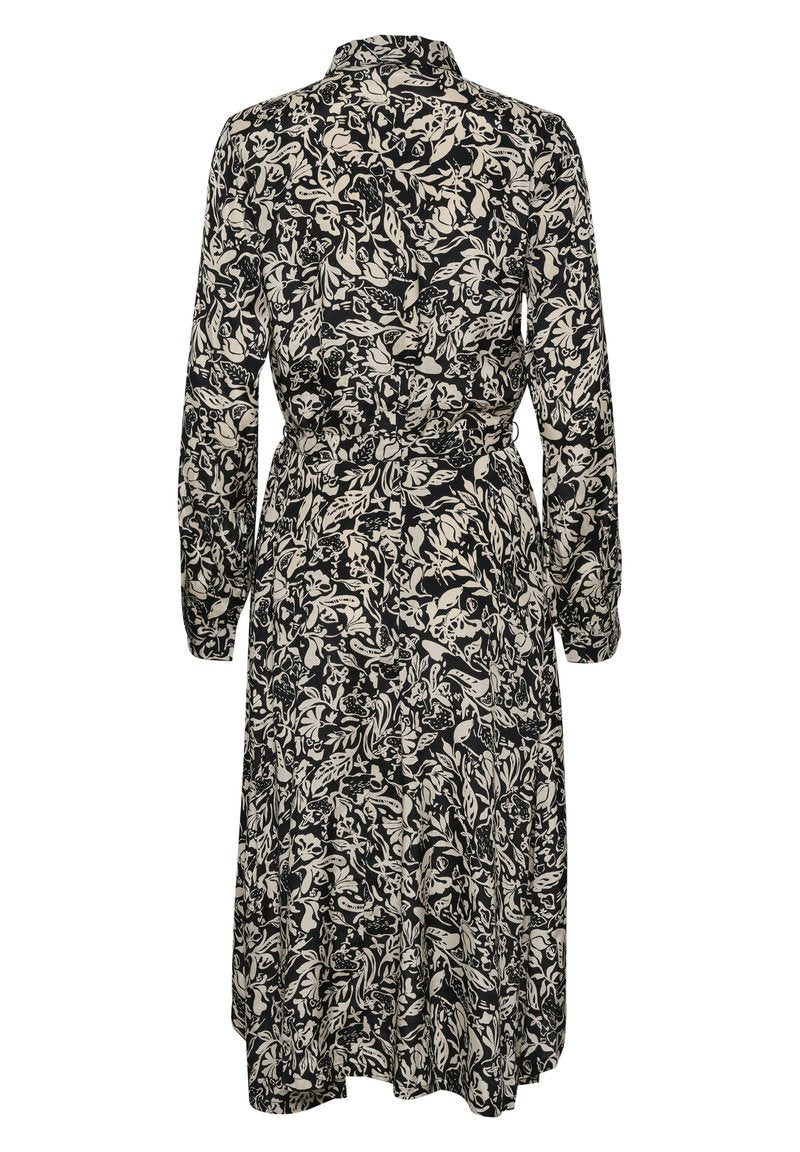 Schwarz-weißer midilanger Kleid mit Blumenmuster, langen Ärmeln, tailliertem Bund, Kragen und fließender Silhouette sowie strukturiertem Muster.
