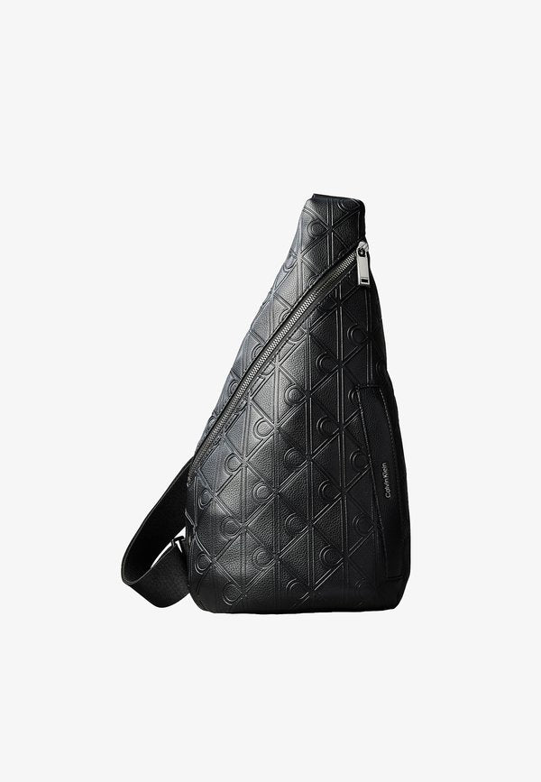 Calvin Klein CALVIN KLEIN DEBOSSED ALLOVER EMBLEM LOGO SLING BAG - Rucksack - black