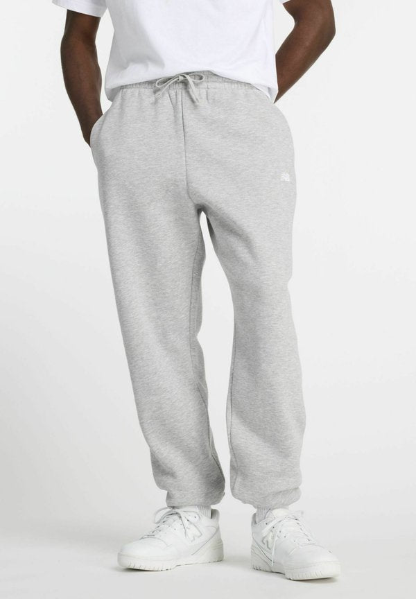 New Balance SPORT ESSENTIALS JOGGER - Tracksuit bottoms - athletic grey ag
