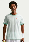 Nike Performance HERITAGE - Sports T-shirt - barely green