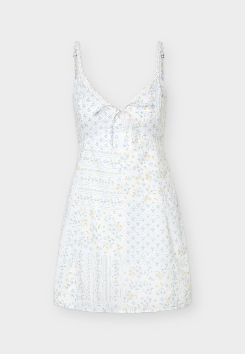 Weißes ärmelloses Minikleid mit dünnen verstellbaren Trägern, V-Ausschnitt, dezenten floralen und geometrischen Mustern und einer kleinen vorderen Bindeschleife.