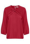 Rote Bluse mit Rundhalsausschnitt, Drehdetail an der Vorderseite und elastischen langen Ärmeln. Glattes Material mit lockerer Passform.