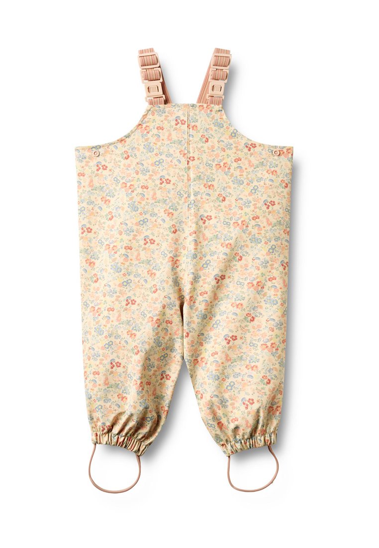 Overall mit Blumenmuster auf hellbeigem Hintergrund, verstellbaren rosa Trägern, elastischen Bündchen und Schlaufen an den Knöcheln für einen sicheren Sitz.