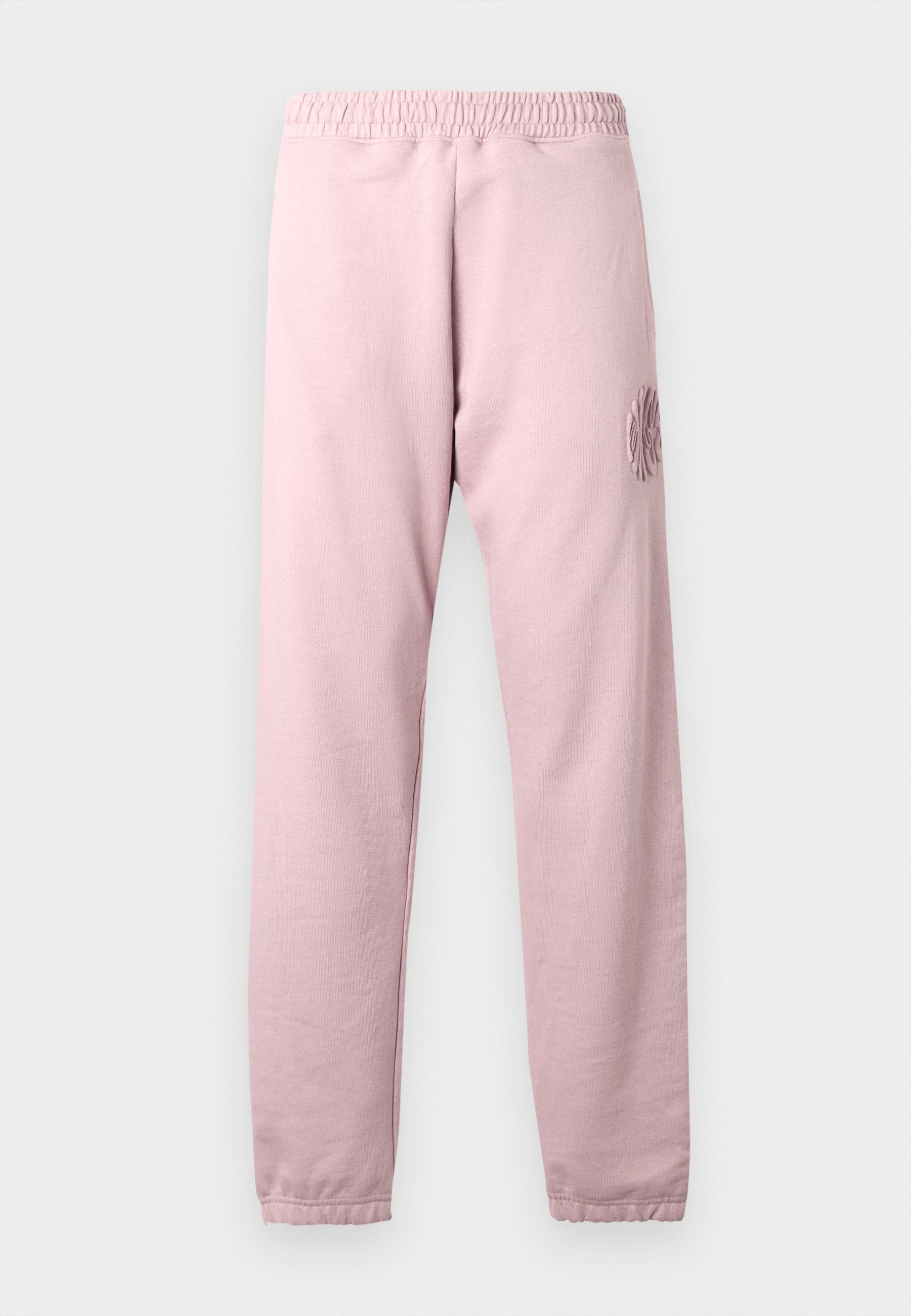 Hellrosa Sweatpants mit elastischem Bund und gerippten Bündchen. Mit einem strukturierten Blumendesign am linken Oberschenkel. Weicher Stoff.