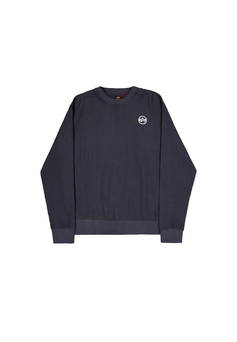 Langärmliges Sweatshirt aus navyblauem Waffelstrick mit gerippten Bündchen, Saum und einem kleinen weißen runden Logo auf der oberen linken Brust.