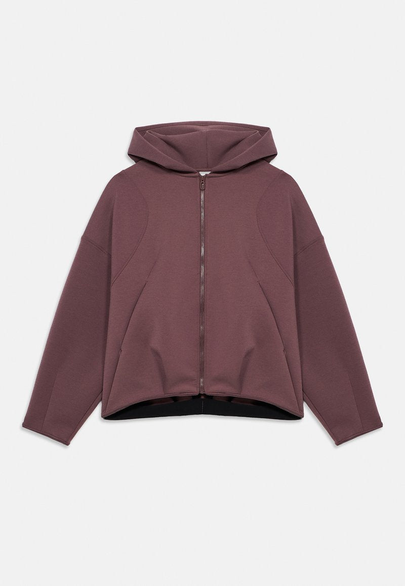 Unisex mauve Zip-up Hoodie mit langen Ärmeln, lockerem Schnitt und angenähter Kapuze, flach auf weißem Hintergrund dargestellt.
