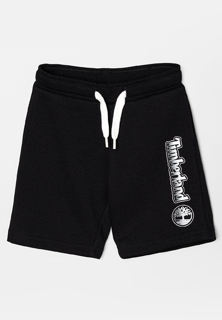Schwarze Shorts mit weißem Kordelzug und Timberland-Logo in weißem Text sowie Baum-Emblem am rechten Bein.