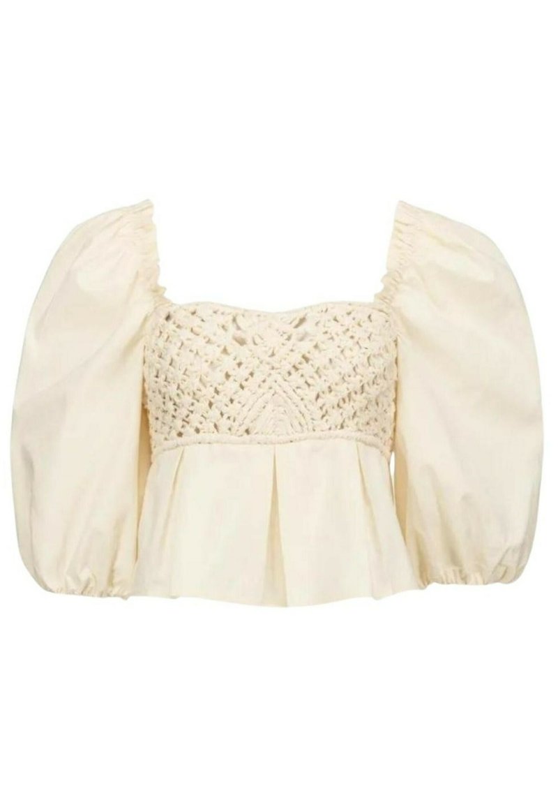 Cremfarbene Bluse mit Puffärmel, einem strukturierten gehäkelten Oberteil und einem gerafften Peplum-Saum. Sie zeichnet sich durch einen weichen, leichten Stoff aus.