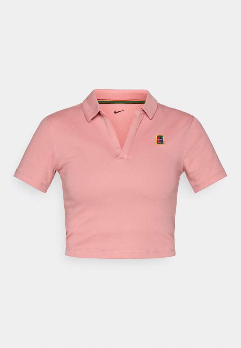 Rosa, kurz geschnittenes Polohemd aus Baumwolle mit einer Knopfleiste mit zwei Knöpfen, kurzen Ärmeln und einem kleinen Nike-Logo auf der Brust.
